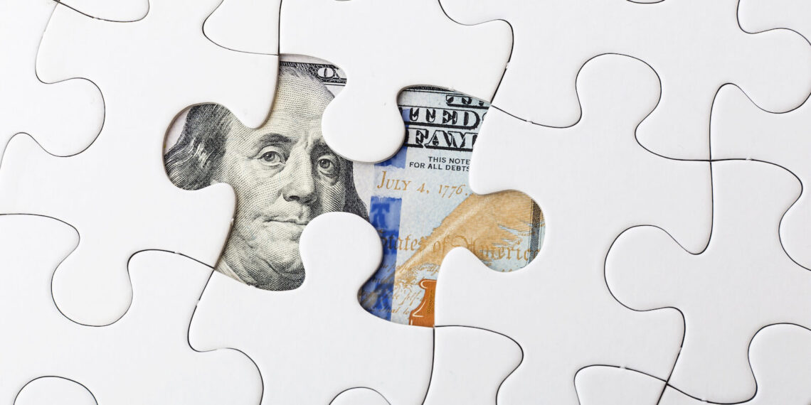 Missing puzzle piece with money under it signifying litigation funding is the missing link to a legal case
